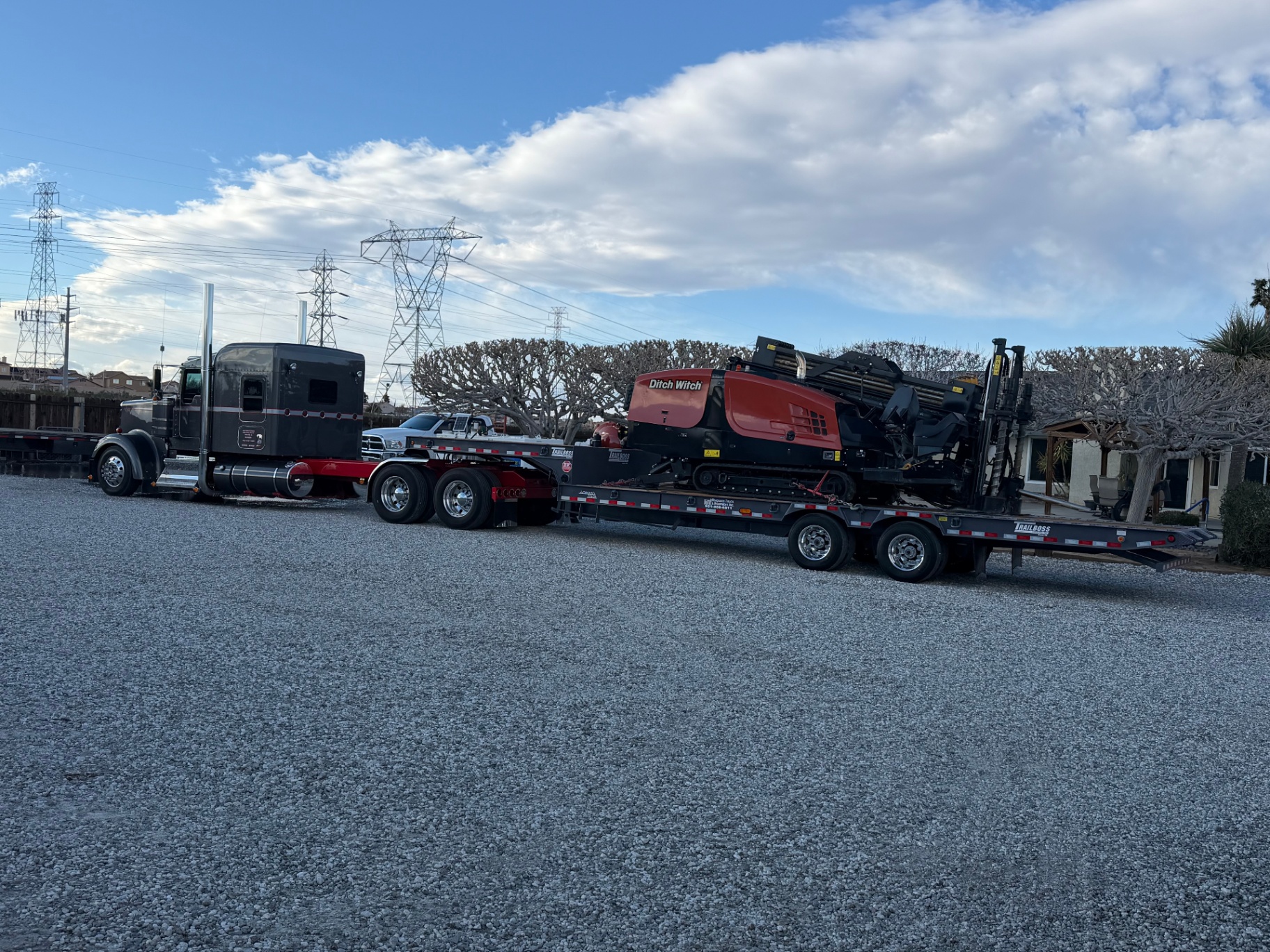 Ditch Witch JT-series rig mobilizing from the yard