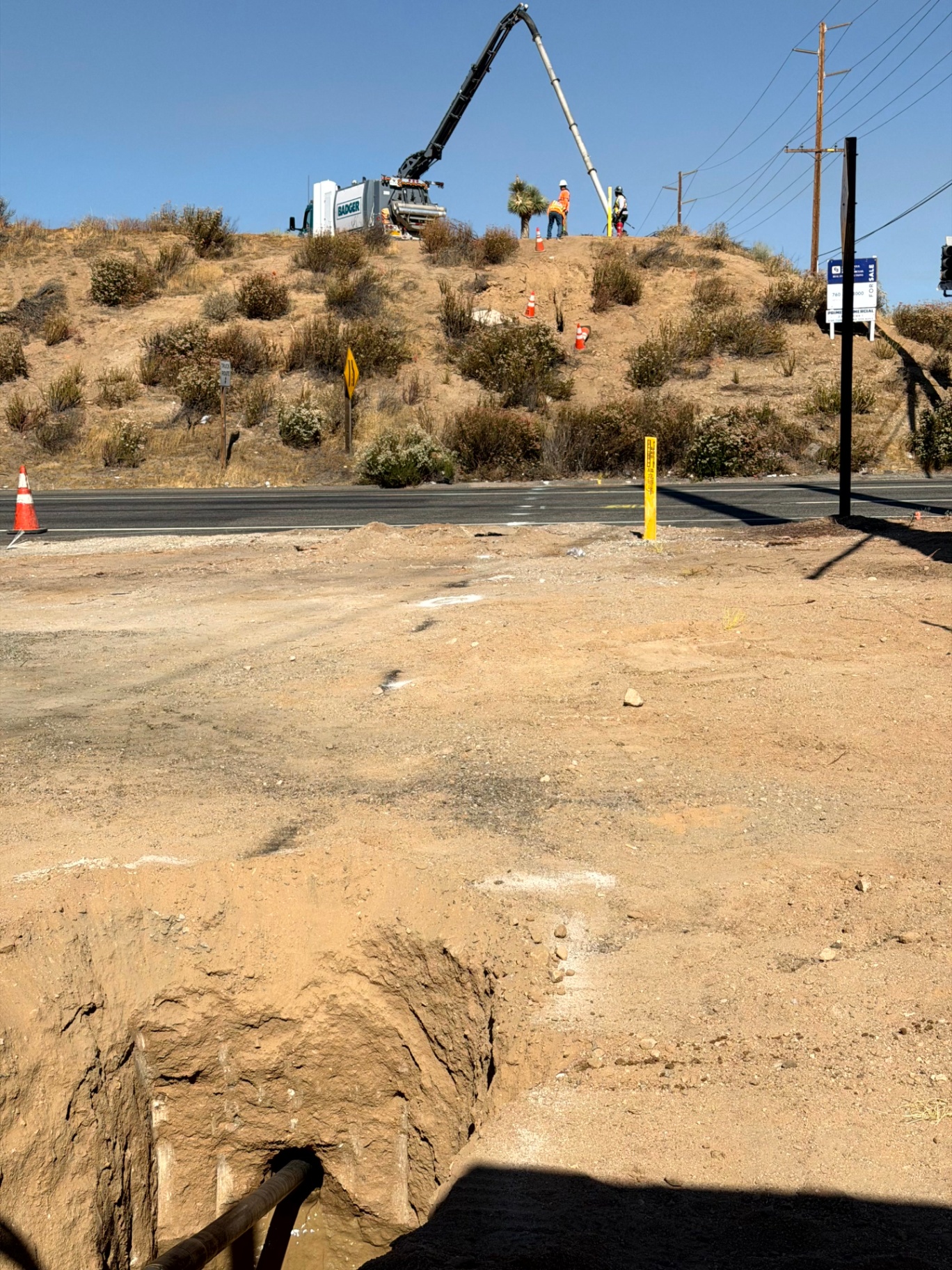 Setting product across Hwy 395 in Oak Hills, CA