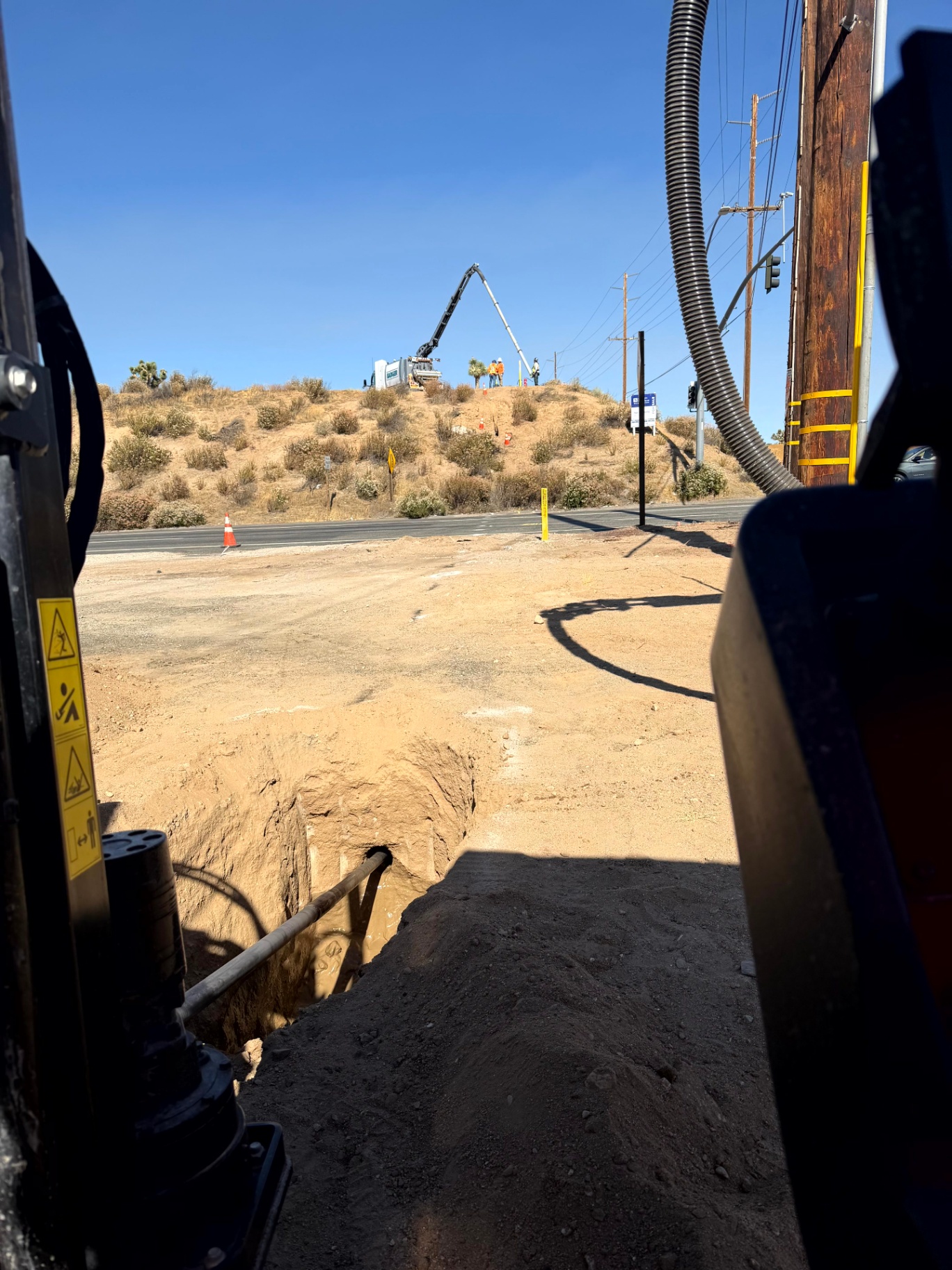 Bore pit with concrete pumper on the ridge — Oak Hills, CA