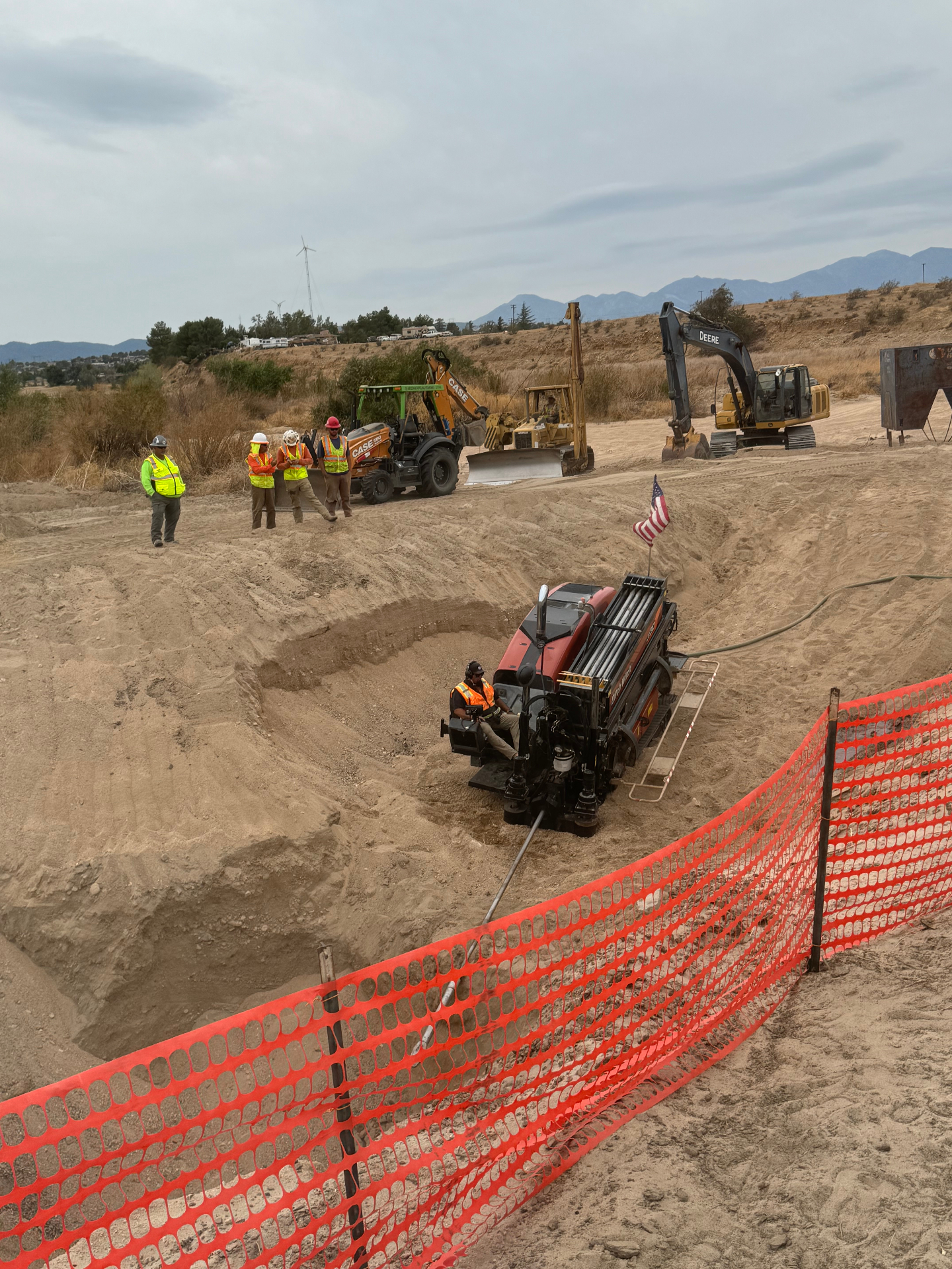 Drill rig in shored pit with the crew and support equipment staged above