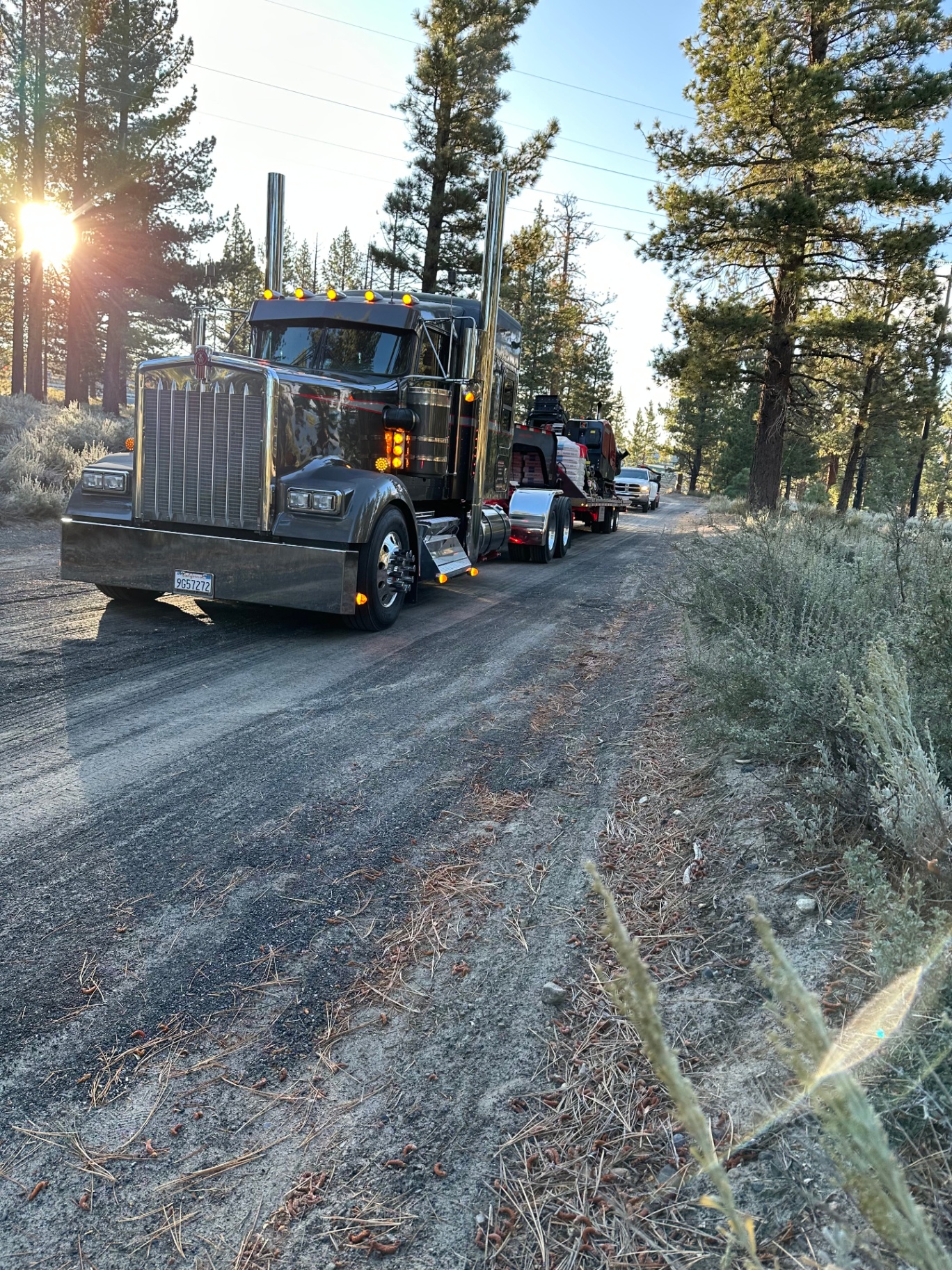 Truck and trailer rolling into mountain job access